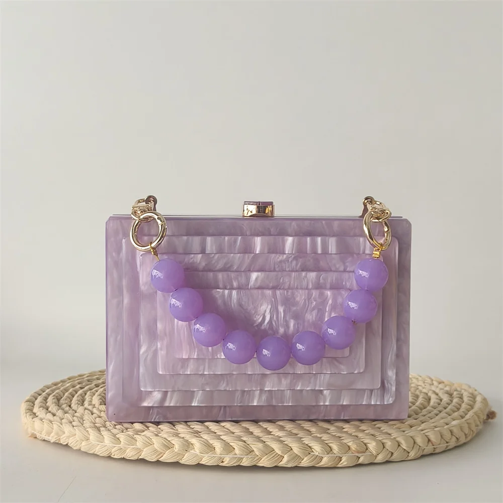 Женские элегантные акриловые клатчи с жемчугом и мрамором для женщин, роскошные брендовые женские сумки с фиолетовой ручкой из бисера на заказ, вечерние сумки
Женские элегантные акриловые клатчи с жемчугом и мрамором для женщин, роскошные брендовые женские сумки с фиолетовой ручкой из бисера на заказ, вечерние сумки