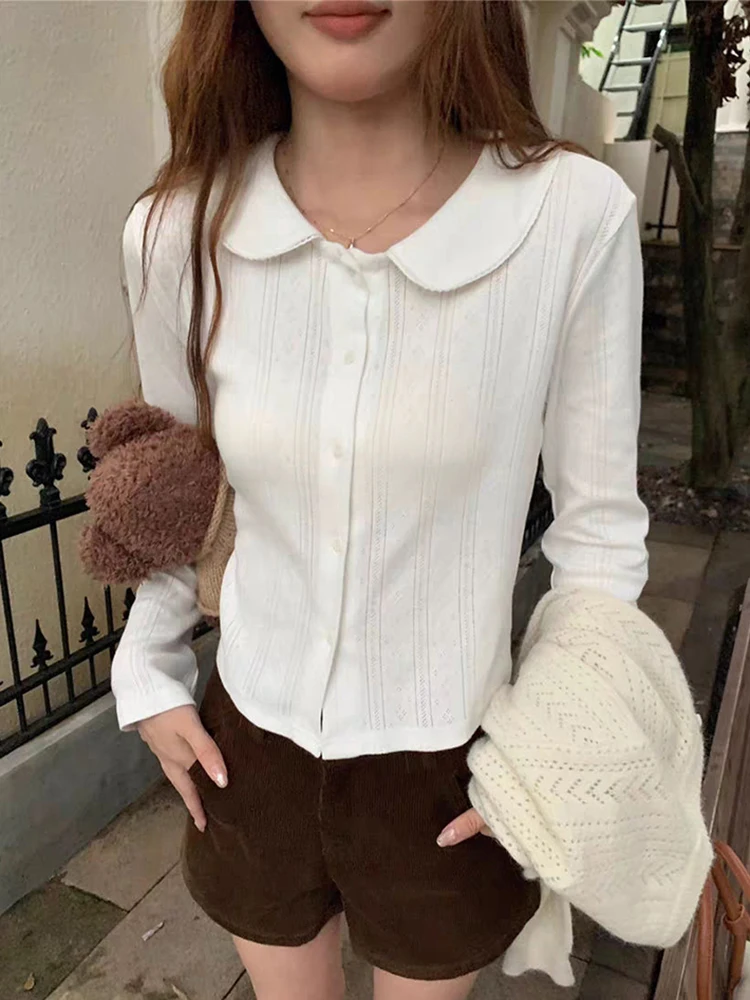 Укороченная рубашка из чистого хлопка, женская осенняя винтажная блузка с воротником Питера Пэна в консервативном стиле, повседневные корейские студенческие топы с длинными рукавами
Укороченная рубашка из чистого хлопка, женская осенняя винтажная блузка с воротником Питера Пэна в консервативном стиле, повседневные корейские студенческие топы с длинными рукавами