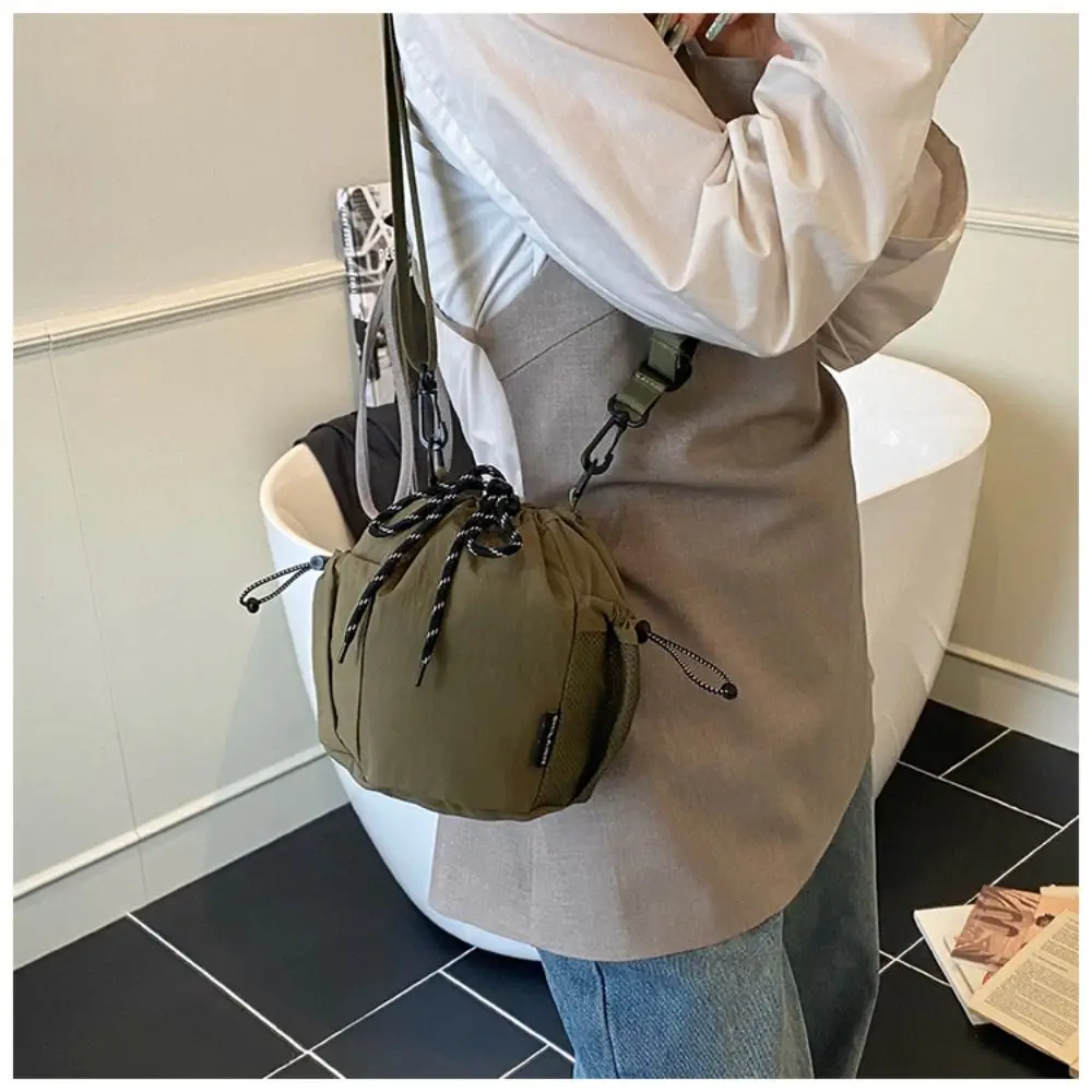 Korean Style Drawstring Bucket Bag Purse Solid Color Nylon Shoulder Bag Handbag Mobile Phone Bag Small Crossbody Bag Travel
Korean Style Drawstring Bucket Bag Purse Solid Color Nylon Shoulder Bag Handbag Mobile Phone Bag Small Crossbody Bag Travel