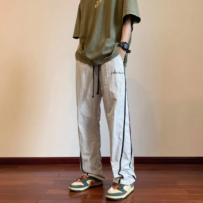 Summer Stripe Quick Drying Casual Pants Men Solid Patchwork Embroidery Elastic Waist Drawstring Pocket Loose Straight Trousers
Summer Stripe Quick Drying Casual Pants Men Solid Patchwork Embroidery Elastic Waist Drawstring Pocket Loose Straight Trousers