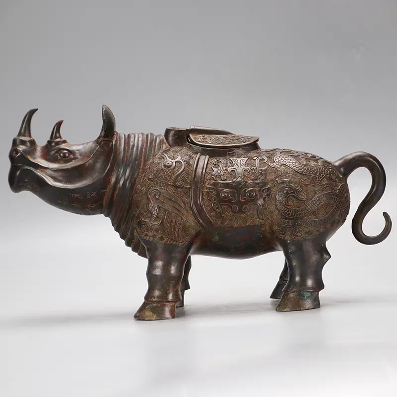 Bronze antique ornaments with inscriptions, rhinoceros statues, bronze rhinoceros statues, wine vessels, handicrafts,
Bronze antique ornaments with inscriptions, rhinoceros statues, bronze rhinoceros statues, wine vessels, handicrafts,