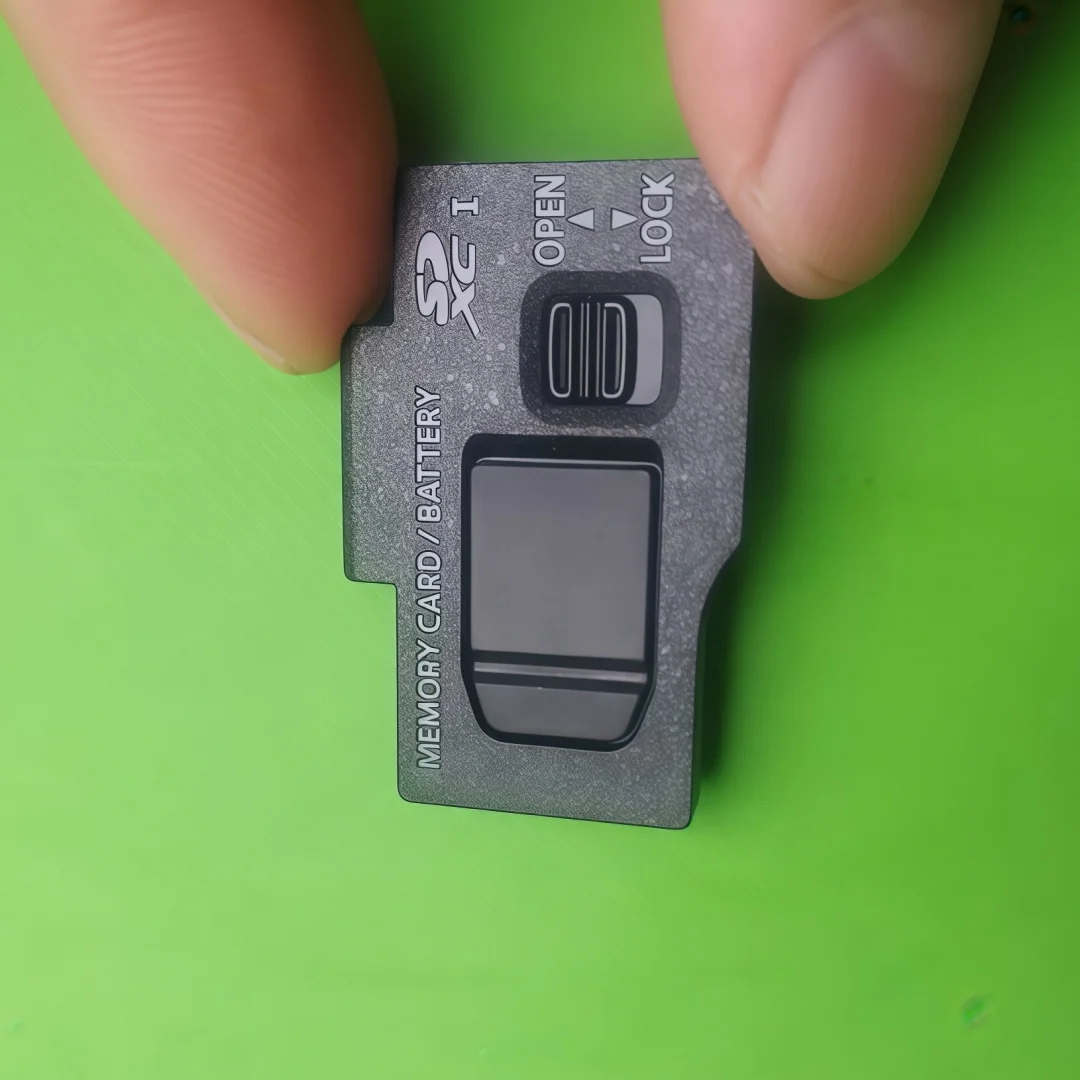 Genuine Battery Door Cover Replacement Repair Part for Panasonic Lumix DC-GX9 Camera
Genuine Battery Door Cover Replacement Repair Part for Panasonic Lumix DC-GX9 Camera