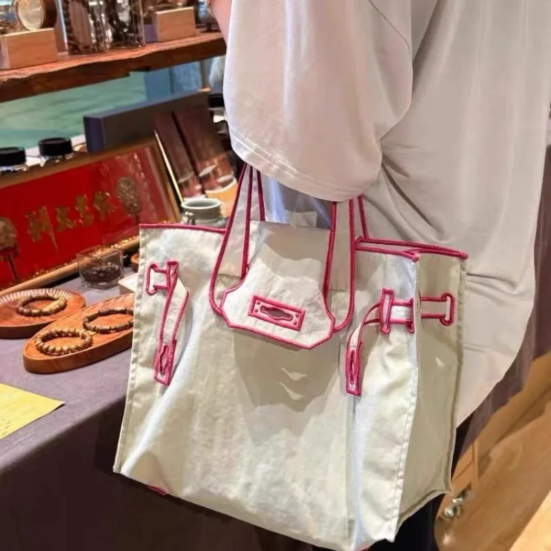 Japanese Nylon High-end Commuter Large-capacity Portable Environmental Protection Casual Embroidery Shopping Storage Bag
Japanese Nylon High-end Commuter Large-capacity Portable Environmental Protection Casual Embroidery Shopping Storage Bag