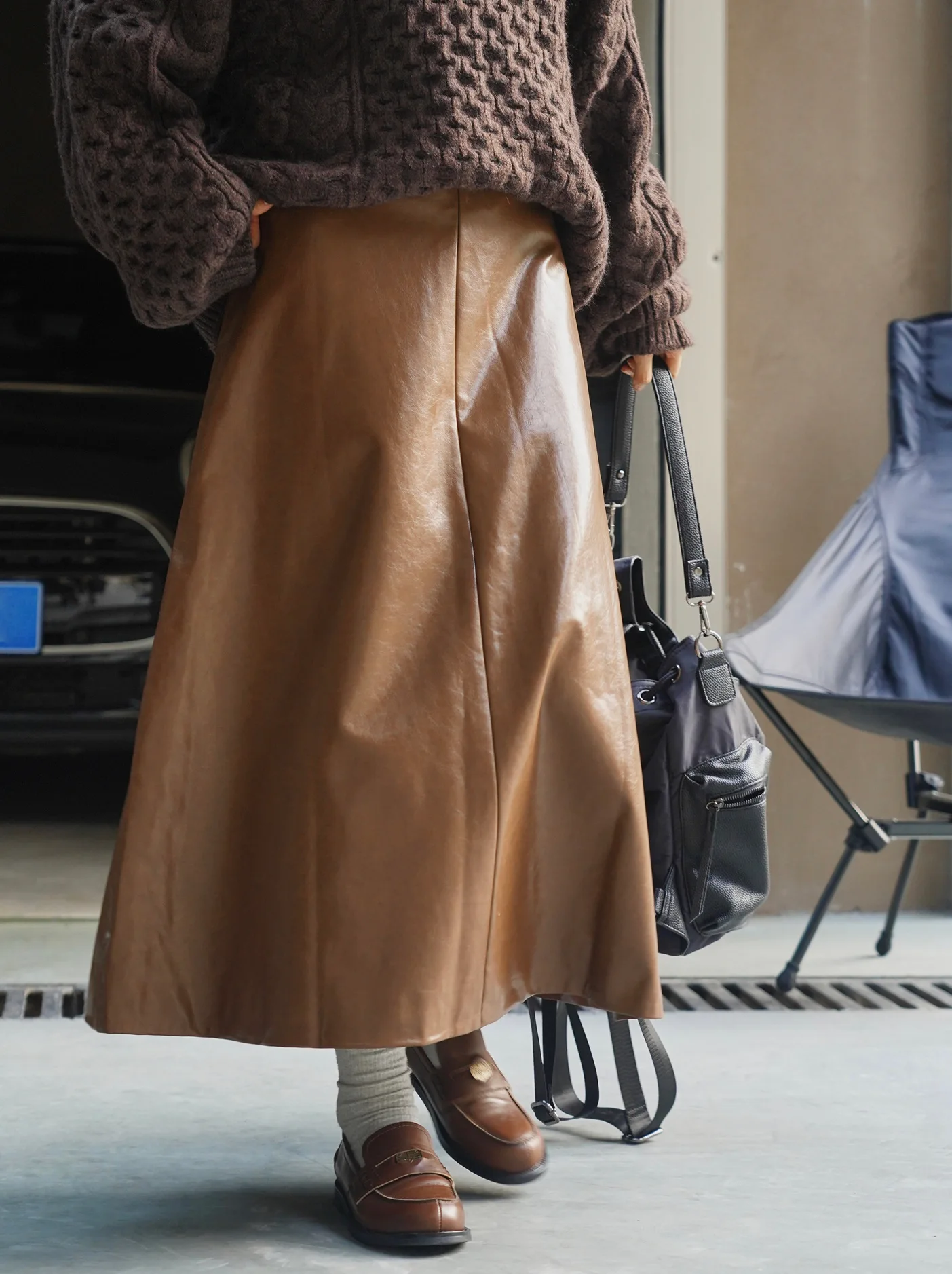 Autumn and winter women's casual solid color high waisted loose fitting PU skirt
Autumn and winter women's casual solid color high waisted loose fitting PU skirt