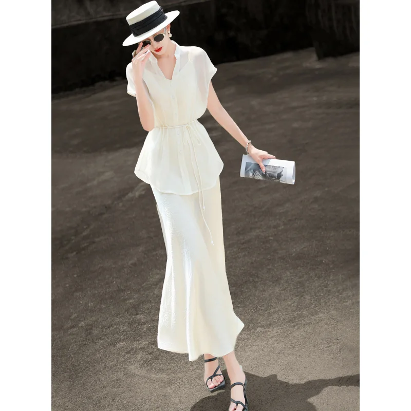 MEXCOCO 2026 Summer Commuter Elegant Stand Collar Cap Sleeve Drawstring Peplum Shirt Acetate Split Slip Skirt 2 In 1 Two Piece
MEXCOCO 2026 Summer Commuter Elegant Stand Collar Cap Sleeve Drawstring Peplum Shirt Acetate Split Slip Skirt 2 In 1 Two Piece