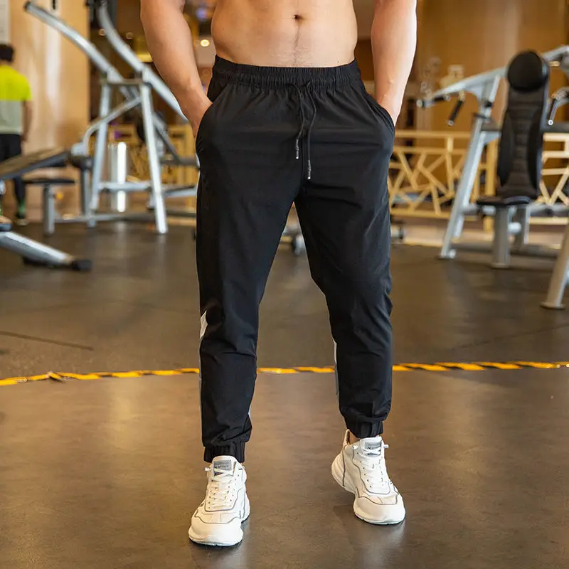 Ice Silk Sports Trousers for Men Quickly Dry Loose Summer Tying Feet Closed Casual Running Training Fitness Sweatpants Trend
Ice Silk Sports Trousers for Men Quickly Dry Loose Summer Tying Feet Closed Casual Running Training Fitness Sweatpants Trend