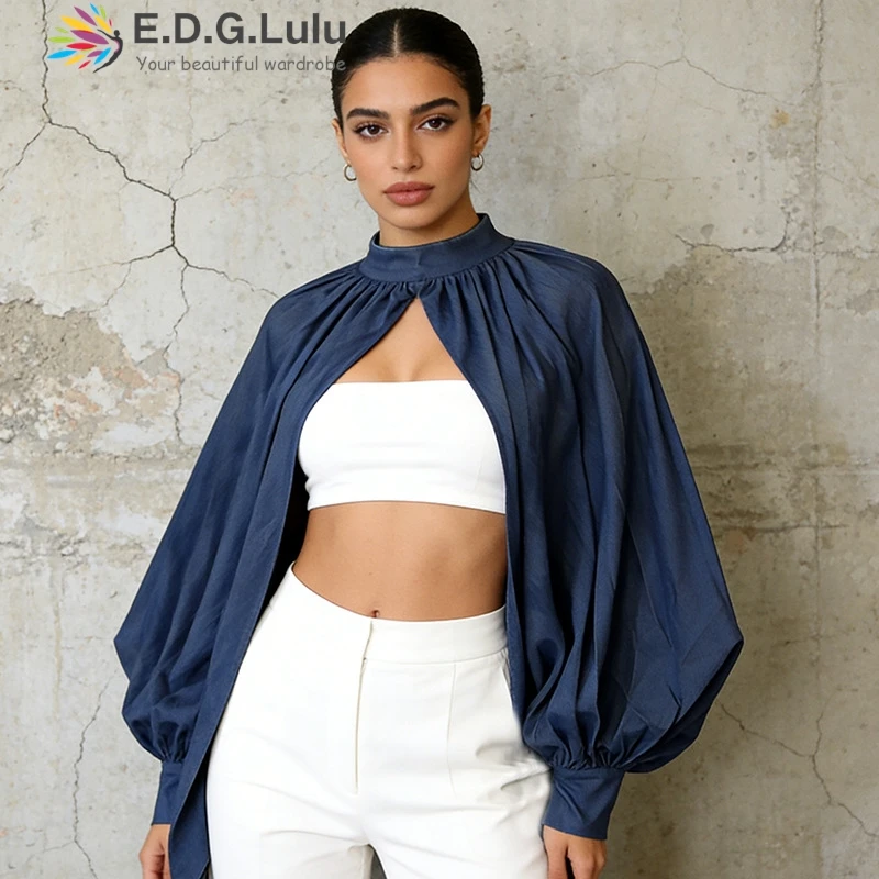 EDGLuLu Street Leisure 2026 New High Neck Stand Up Collar Bubble Sleeve Top Fashion Design Hollowed Out Cape Top 0513
EDGLuLu Street Leisure 2026 New High Neck Stand Up Collar Bubble Sleeve Top Fashion Design Hollowed Out Cape Top 0513
