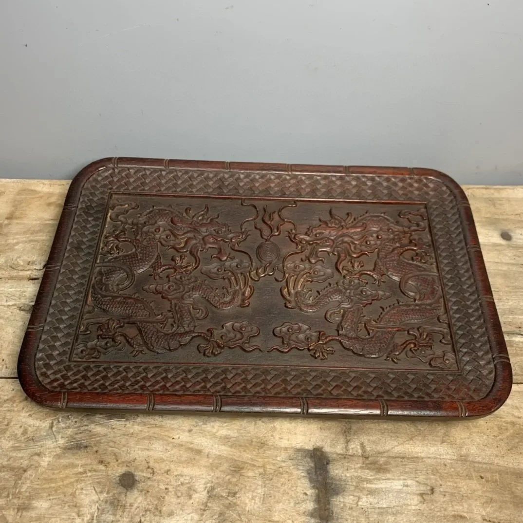 Hand-Carved Small Leaf Red Sandalwood Tea Tray with Double Dragons Playing with a Pearl
Hand-Carved Small Leaf Red Sandalwood Tea Tray with Double Dragons Playing with a Pearl