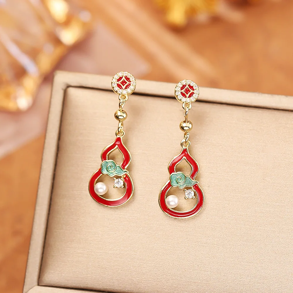 Fashionable and exquisite red hollow oil-drip gourd earrings pearl zircon long earrings elegant temperament personalized earring
Fashionable and exquisite red hollow oil-drip gourd earrings pearl zircon long earrings elegant temperament personalized earring