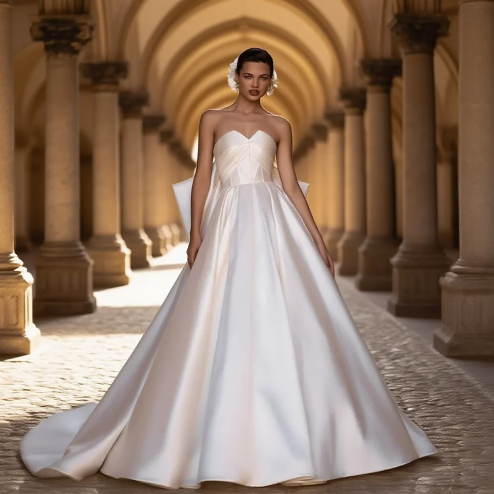 Customized Satin A-Line Wedding Dress Sweetheart Neckline Sleeveless Big Bow Back Floor Length Sweep Train Gown for Bride 2025
Customized Satin A-Line Wedding Dress Sweetheart Neckline Sleeveless Big Bow Back Floor Length Sweep Train Gown for Bride 2025