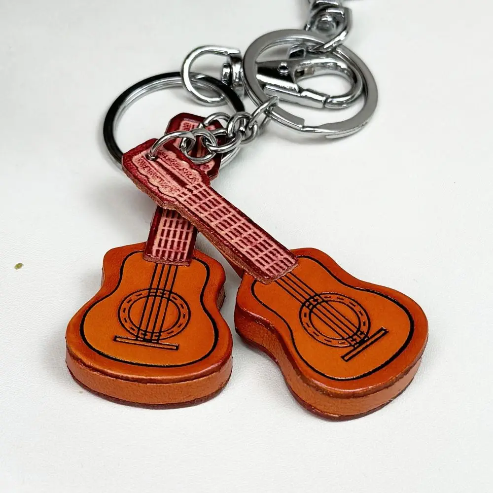 Cowhide Classical Guitar Keychain Vintage Leather Classical Guitar Keyring Bag Charm Spanish Guitar Musical Instrument Pendant
Cowhide Classical Guitar Keychain Vintage Leather Classical Guitar Keyring Bag Charm Spanish Guitar Musical Instrument Pendant