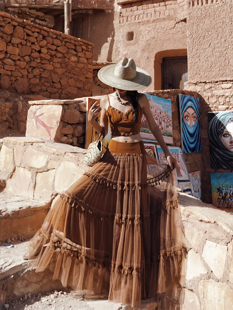 TIYIHAILEY Sleeveless Women Brown Short Tops And Long Maxi Mesh Tassels Skirt With Slit 2 Pcs Set 2026 New Fashion
TIYIHAILEY Sleeveless Women Brown Short Tops And Long Maxi Mesh Tassels Skirt With Slit 2 Pcs Set 2026 New Fashion