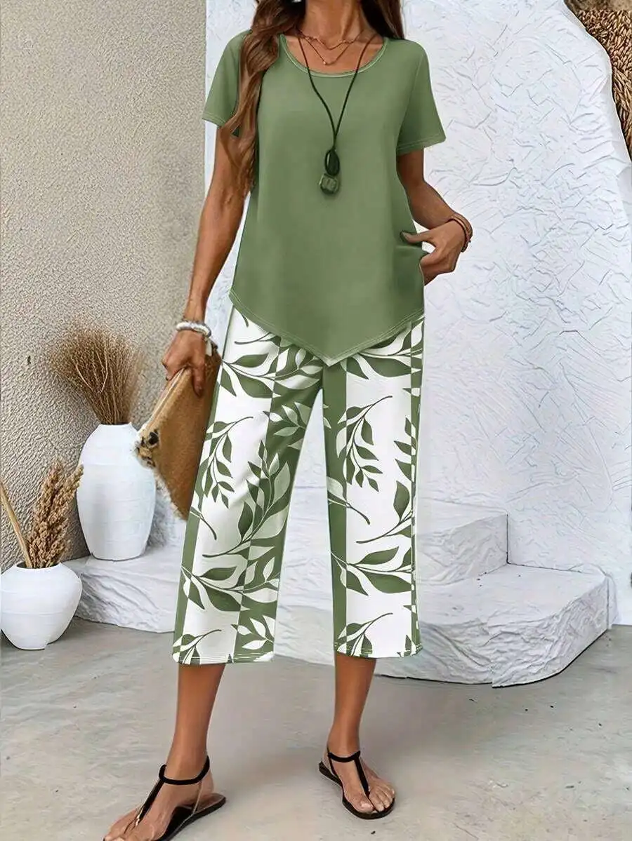 Womens Casual Two-Piece Set: Short Sleeve Round Neck Top And Leaf Print Wide Leg Capri Pants
Womens Casual Two-Piece Set: Short Sleeve Round Neck Top And Leaf Print Wide Leg Capri Pants