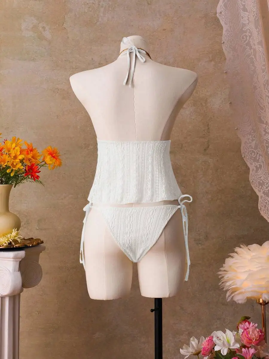 White Halter Neck Two Piece Swimwear Set With Tie Back And Side Ties
White Halter Neck Two Piece Swimwear Set With Tie Back And Side Ties