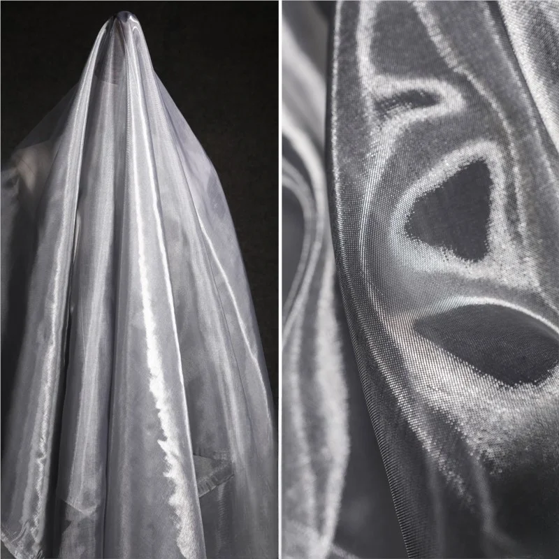 Silver-lustrous silk thread mesh fabric hard organza stiff and dense gauze fabric clothing designer fabric
Silver-lustrous silk thread mesh fabric hard organza stiff and dense gauze fabric clothing designer fabric