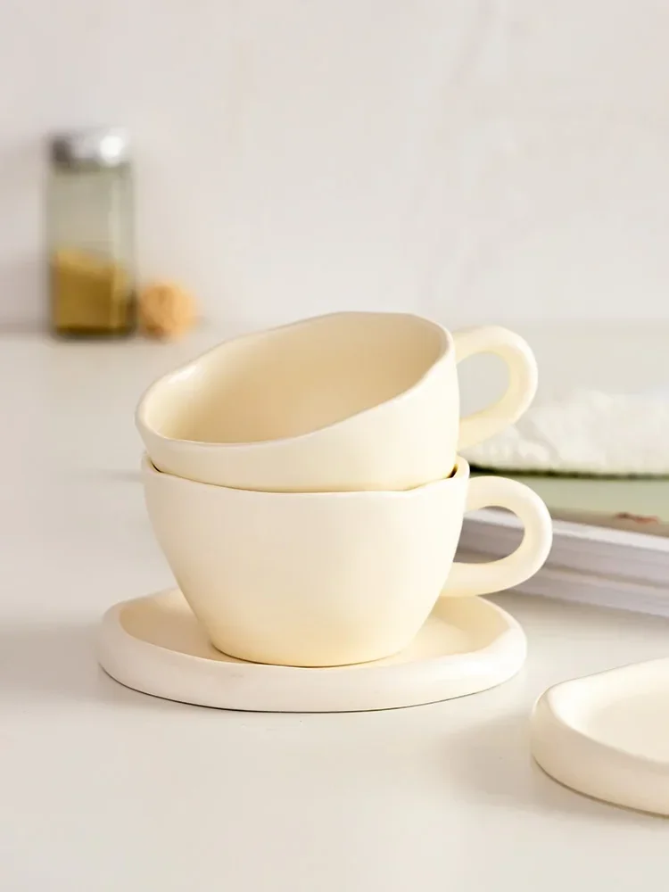 Elegant Cream Texture Ceramic Mug Set for Couples High-Quality Coffee Mug Saucer for Stylish Women Ideal Gift for Coffee Lovers
Elegant Cream Texture Ceramic Mug Set for Couples High-Quality Coffee Mug Saucer for Stylish Women Ideal Gift for Coffee Lovers