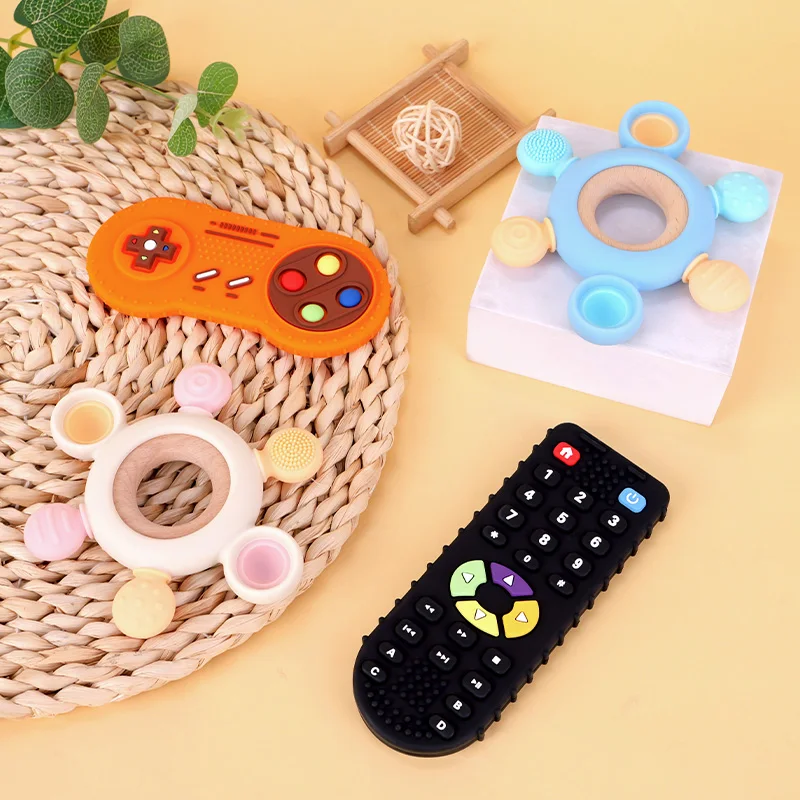 3PCS Soft Toys TV Remote Control Shape Kids Teething Food Grade Silicone Infant Rudder Teether with Wooden Ring
3PCS Soft Toys TV Remote Control Shape Kids Teething Food Grade Silicone Infant Rudder Teether with Wooden Ring