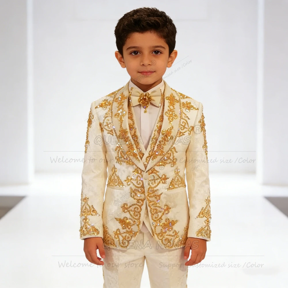 Изысканный наряд для мальчиков, формальные свадебные смокинги, золотые кристаллы, расшитые бисером, детские платья для торжественных случаев, 3 предмета, индивидуальные traje formalne niño
Изысканный наряд для мальчиков, формальные свадебные смокинги, золотые кристаллы, расшитые бисером, детские платья для торжественных случаев, 3 предмета, индивидуальные traje formalne niño