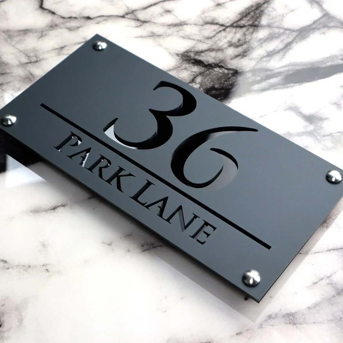 House Wall Plaques | Modern House Number Signs | Elegant Acrylic Design | Outdoor Home Décor Grey & Black Gloss | 30cm x 14cm
House Wall Plaques | Modern House Number Signs | Elegant Acrylic Design | Outdoor Home Décor Grey & Black Gloss | 30cm x 14cm