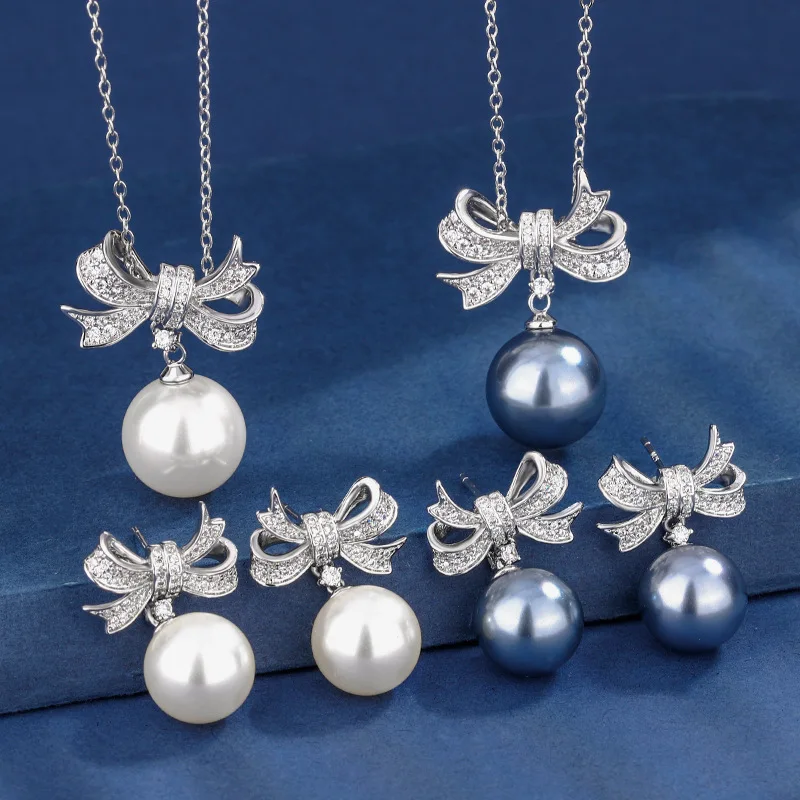 Jewelry set with gold plating and pearl inlay, elegant bow design for women, 14-12mm
Jewelry set with gold plating and pearl inlay, elegant bow design for women, 14-12mm