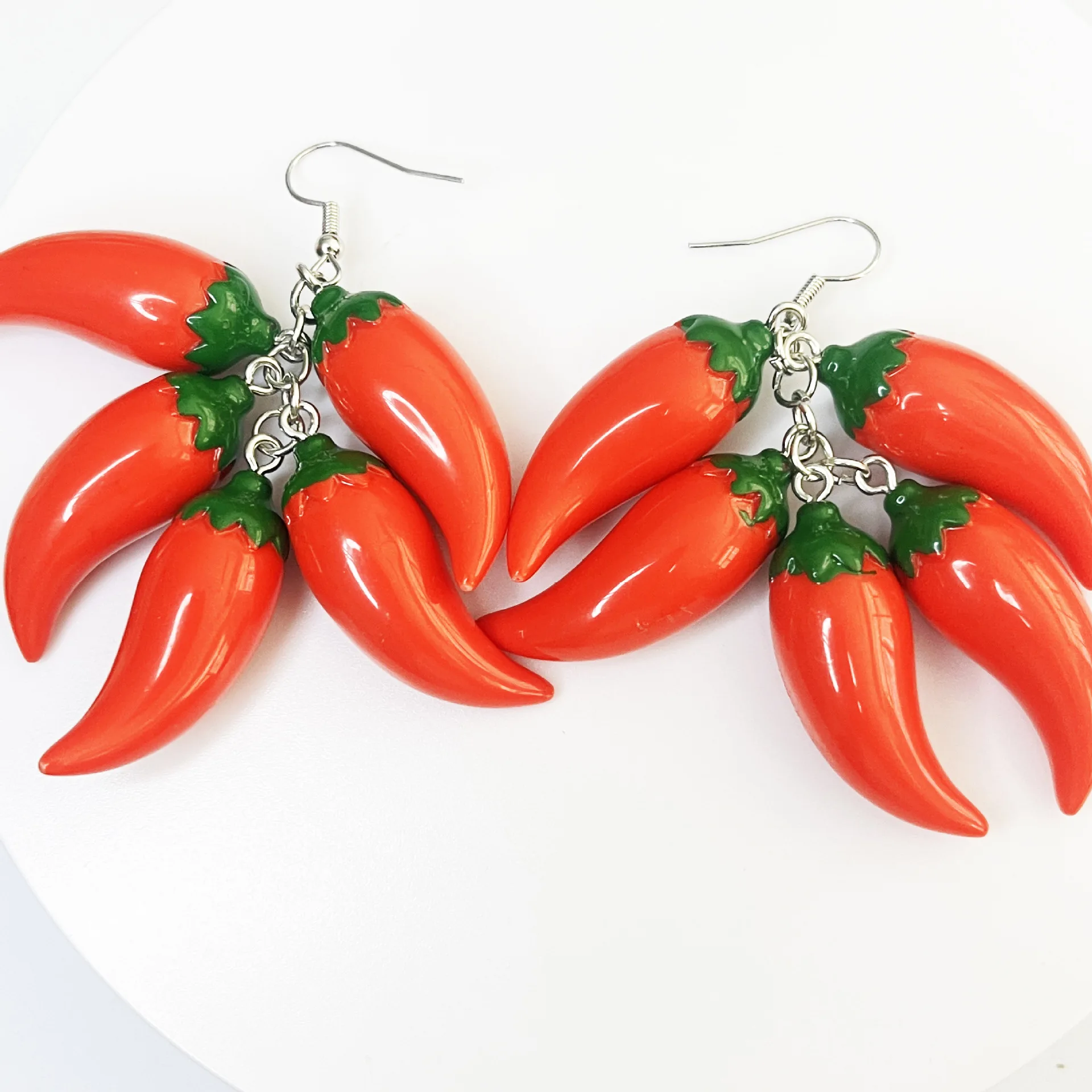 Personalized red pepper earrings resin ear hooks 3D simulation small pepper earrings
Personalized red pepper earrings resin ear hooks 3D simulation small pepper earrings