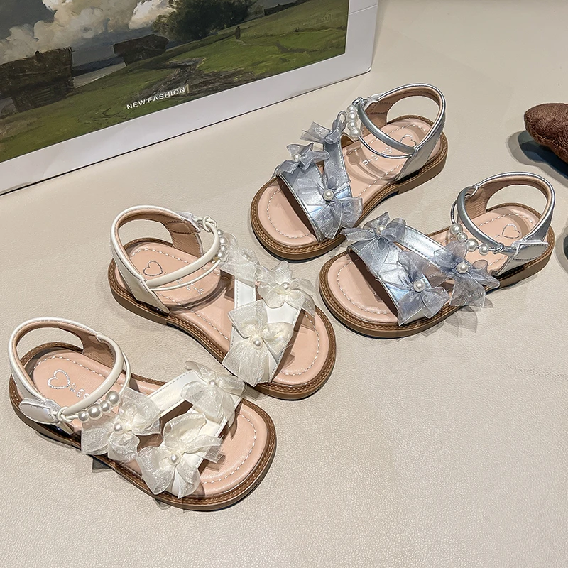 Summer New Girls' Princess Style Open-Toe Sandals with Beautiful Bows and Pearl Decorations Soft Soles with Fashionable Design
Summer New Girls' Princess Style Open-Toe Sandals with Beautiful Bows and Pearl Decorations Soft Soles with Fashionable Design