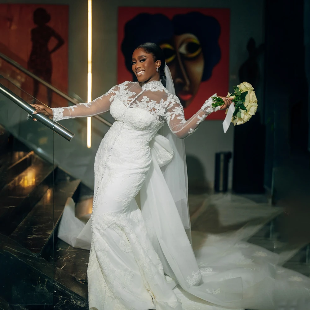 African Mermaid Wedding Dresses Bride 2026 Button High Neck Applique Long Sleeve Summer Bridal Gowns With Bow Train Customized
African Mermaid Wedding Dresses Bride 2026 Button High Neck Applique Long Sleeve Summer Bridal Gowns With Bow Train Customized