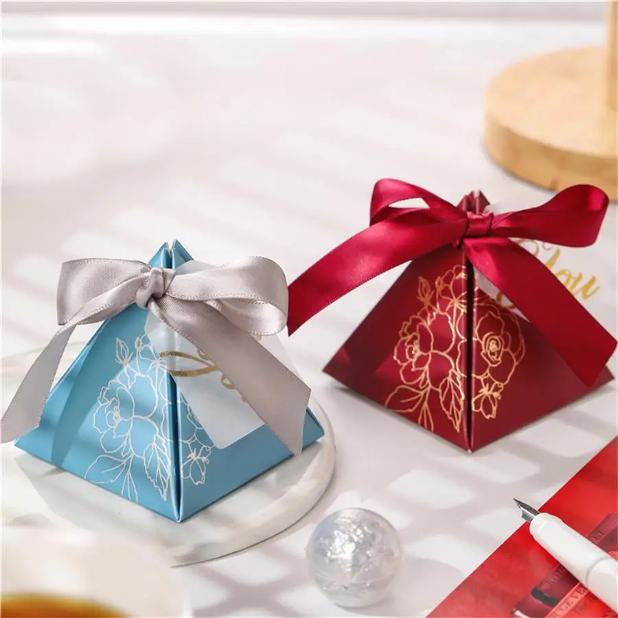 Triangular Pyramid Candy Box Wedding Favors and Gift Box Paper Box Packaging for Wedding Decoration Baby Shower Party Supplies
Triangular Pyramid Candy Box Wedding Favors and Gift Box Paper Box Packaging for Wedding Decoration Baby Shower Party Supplies