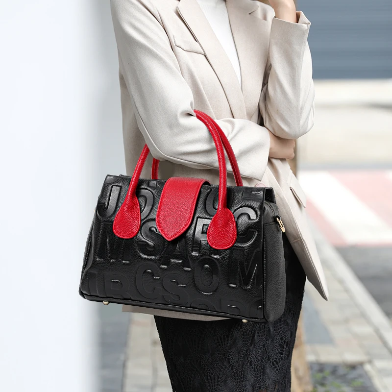 Aidrani Black - Red Leather Handbag: Alphabet Embossing & Color - Block Design
Aidrani Black - Red Leather Handbag: Alphabet Embossing & Color - Block Design