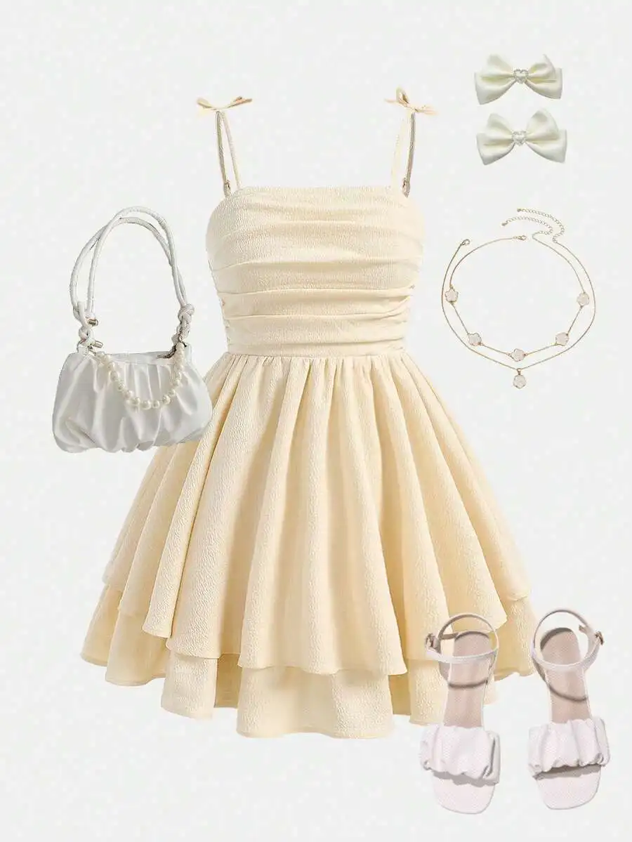 Cream Ruched Double Layer Skirt Hem Spaghetti Strap Dress With Bow Details
Cream Ruched Double Layer Skirt Hem Spaghetti Strap Dress With Bow Details