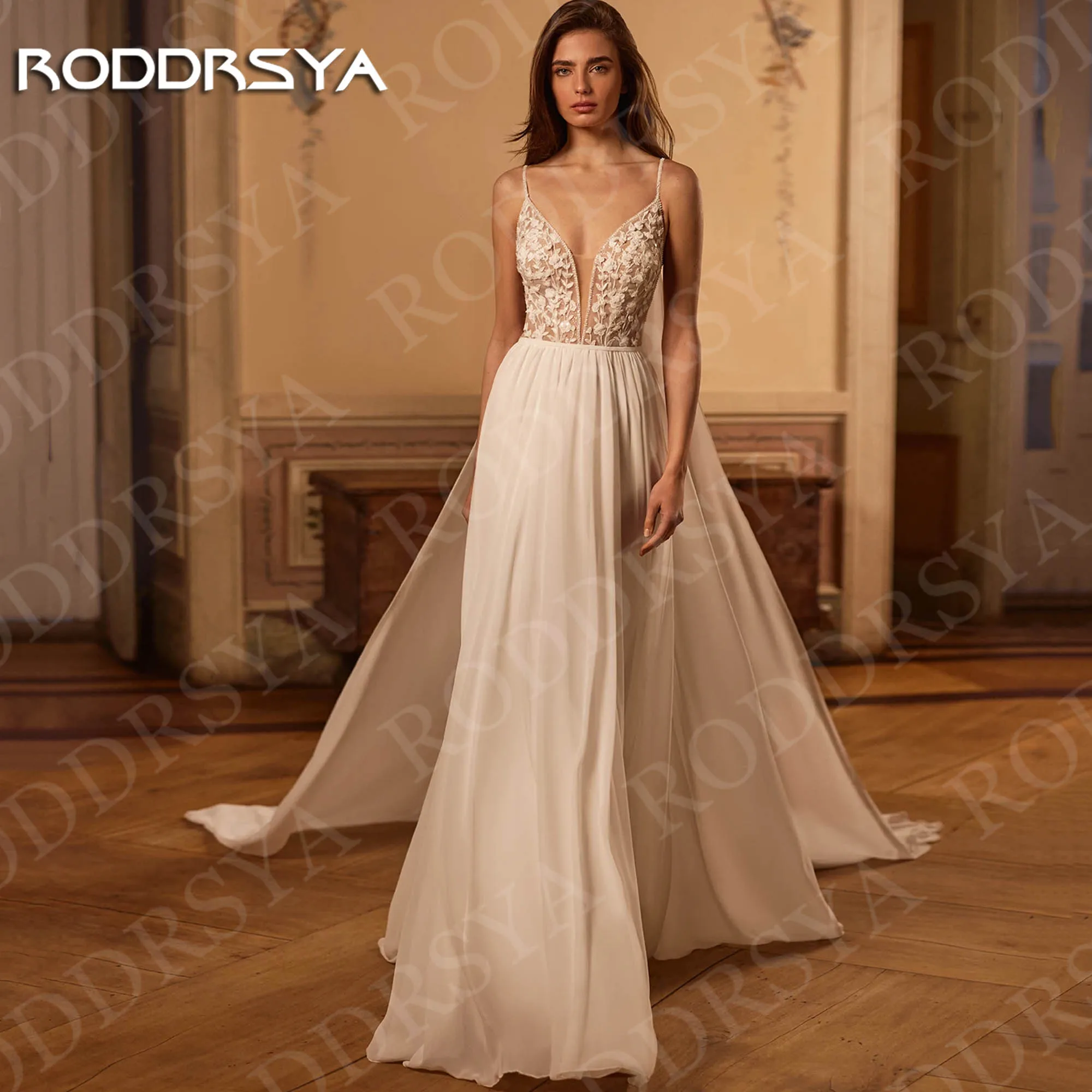 RODDRSYA Beach A Line Chiffion Wedding Dresses Sexy V Neck Spaghetti Straps Lace Bridal Dress Backless Customized robe mariée
RODDRSYA Beach A Line Chiffion Wedding Dresses Sexy V Neck Spaghetti Straps Lace Bridal Dress Backless Customized robe mariée