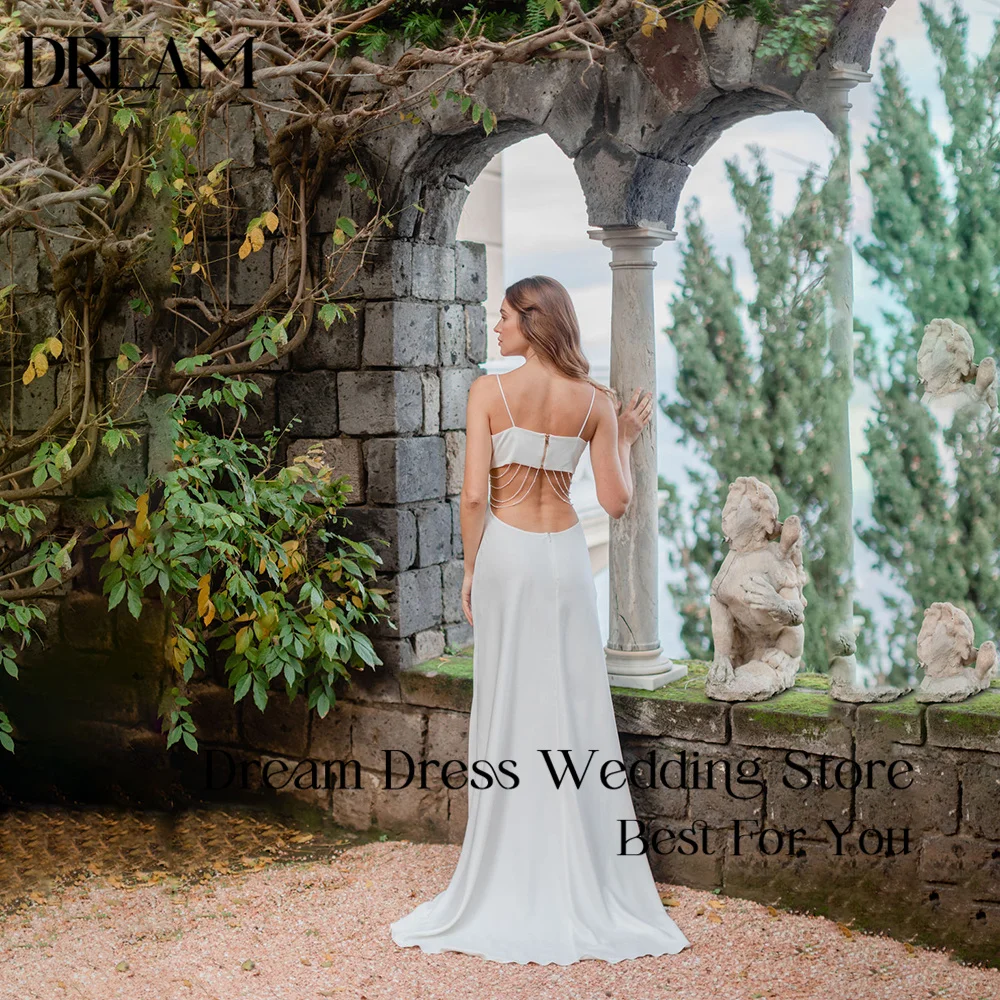 Dream Customized Boho Wedding Dress Spaghetti Straps Satin Cowl Neck Beaded Cutout Back Chain Detail A-Line Train Bridal Gowns
Dream Customized Boho Wedding Dress Spaghetti Straps Satin Cowl Neck Beaded Cutout Back Chain Detail A-Line Train Bridal Gowns