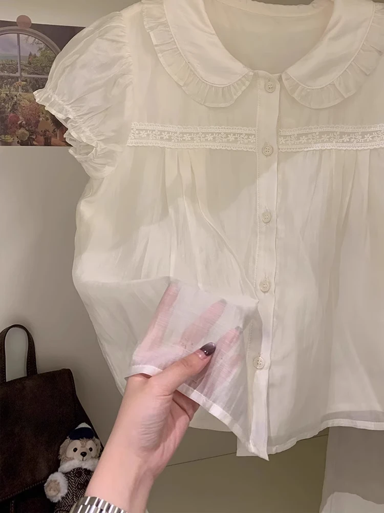 Cute White ort Sve Doll Collar irt Women's Faion Korean Sle Bubble Sve Loose Fit Single Button Closure irt 
Cute White ort Sve Doll Collar irt Women's Faion Korean Sle Bubble Sve Loose Fit Single Button Closure irt