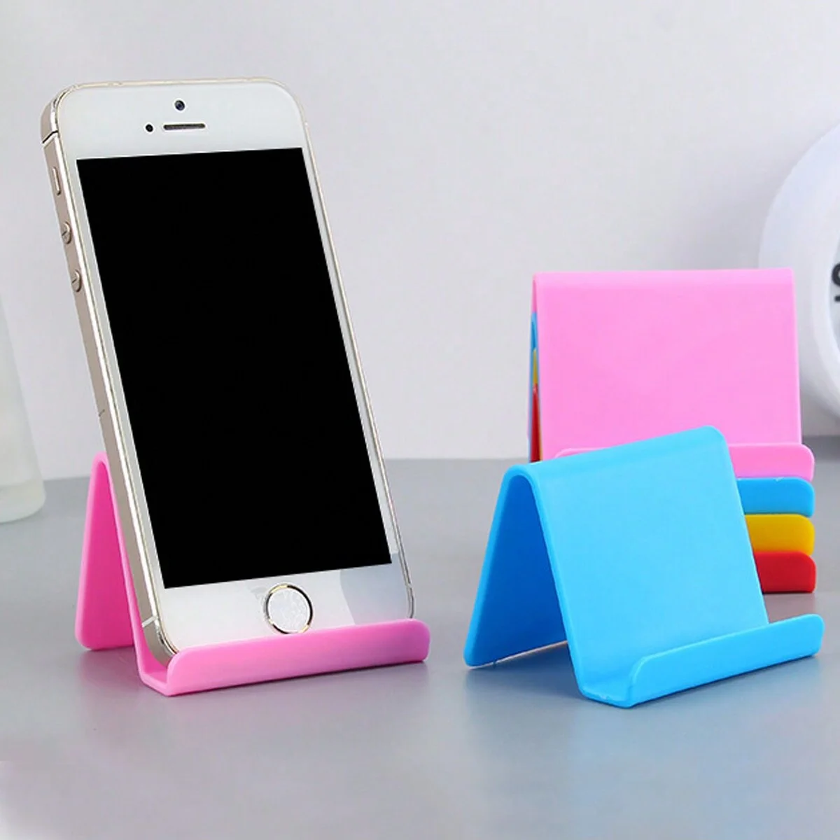 Macaron Color Series Mobile Phone Stand for Desktop and Tablet, Multifunctional File Holder, Lazy Phone Stand for Bedside, Universal Stand for Watching Live Tv.
Macaron Color Series Mobile Phone Stand for Desktop and Tablet, Multifunctional File Holder, Lazy Phone Stand for Bedside, Universal Stand for Watching Live Tv.