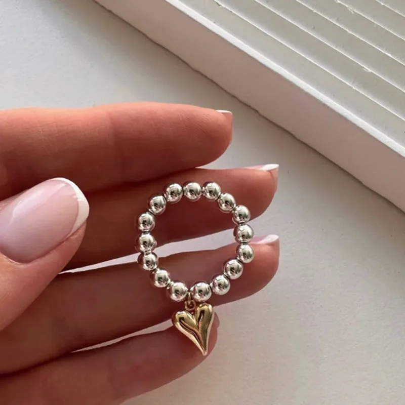 Punk Gold Color Heart Pendant Rings Creative Elastic Rope Round Bead Rings for Women Men Fashion Statement Jewelry Accessories
Punk Gold Color Heart Pendant Rings Creative Elastic Rope Round Bead Rings for Women Men Fashion Statement Jewelry Accessories