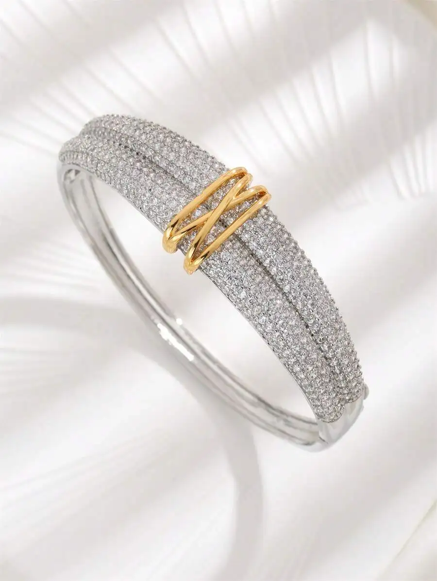 Stunning Dual-Row Paved Zirconia Bangle With Interwoven Gold-Tone Center Motif, Perfect For Daily Styling Or Festive Gifting
Stunning Dual-Row Paved Zirconia Bangle With Interwoven Gold-Tone Center Motif, Perfect For Daily Styling Or Festive Gifting