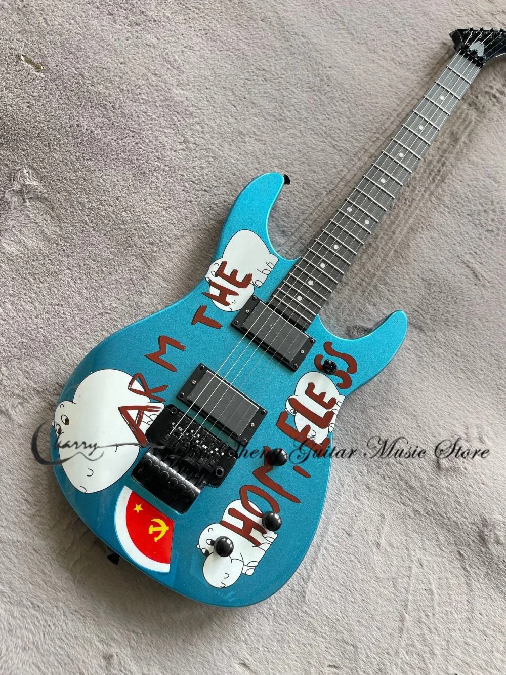 Metal blue guitar, Tremolo bridge, black enclosed pickups, pig pattern, solid wood body, maple neck
Metal blue guitar, Tremolo bridge, black enclosed pickups, pig pattern, solid wood body, maple neck