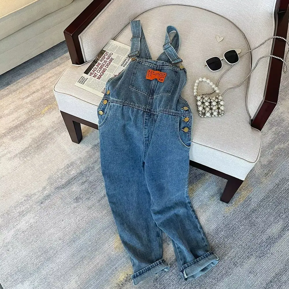 Женские джинсовые комбинезоны прямого кроя, свободные, удлиненные, в американском стиле, рабочие брюки с лямками, повседневные, с высокой талией
Женские джинсовые комбинезоны прямого кроя, свободные, удлиненные, в американском стиле, рабочие брюки с лямками, повседневные, с высокой талией