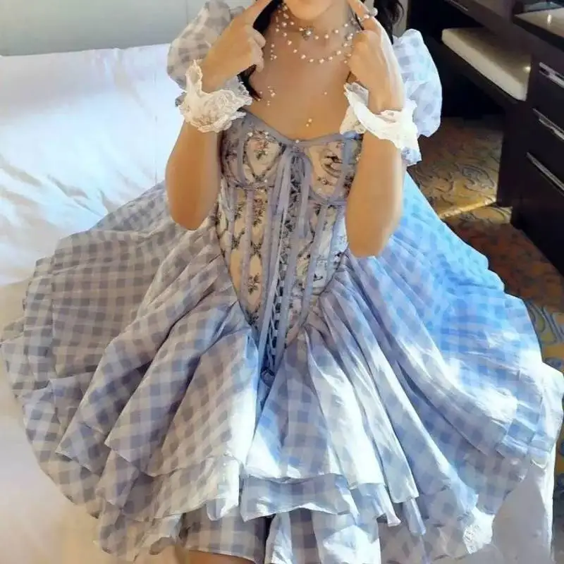 Women Sweet Lolita Dress Blue Plaid Tiered Cake Skirt Puff Sleeve Lace Trim Corset Lace Up Floral Bust Mini Princess Party Dress
Women Sweet Lolita Dress Blue Plaid Tiered Cake Skirt Puff Sleeve Lace Trim Corset Lace Up Floral Bust Mini Princess Party Dress