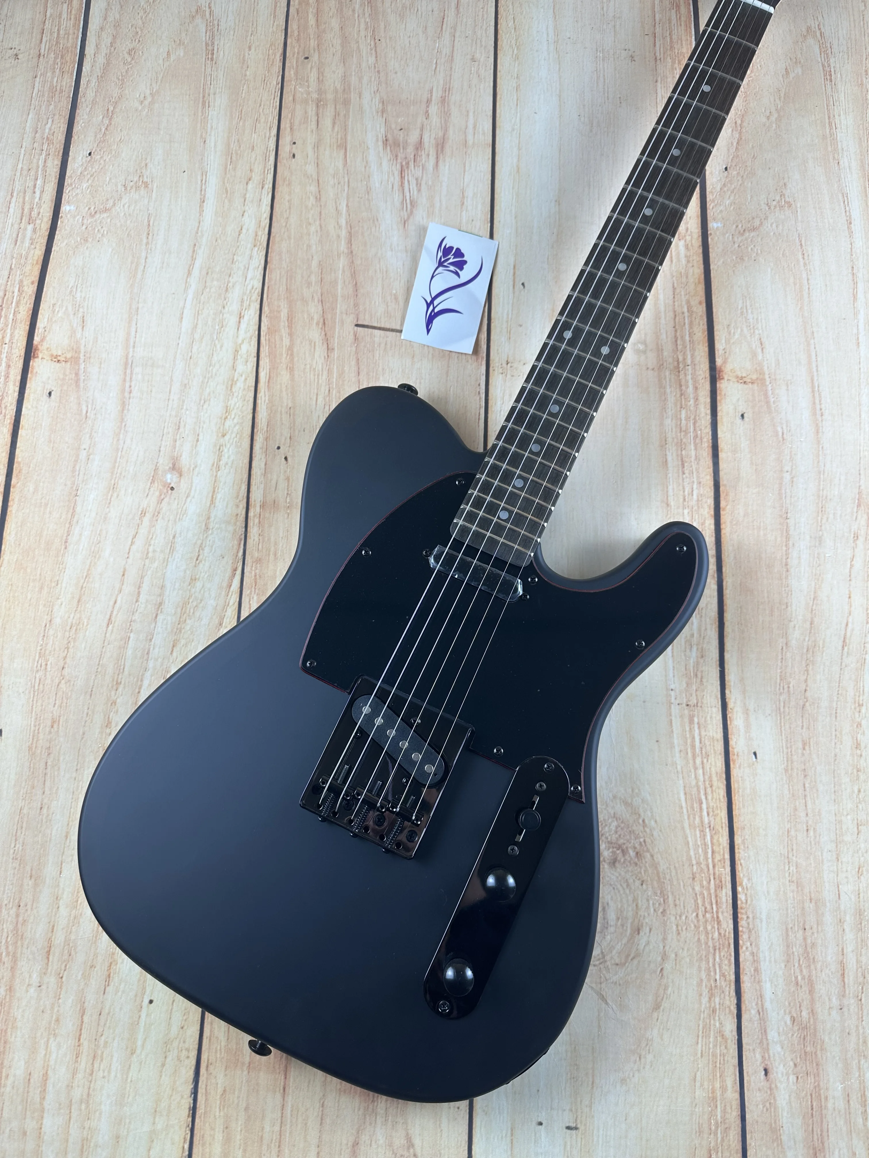 Telecast Electric Guitar, Matte black imported paint, red logo and red body edging, imported alder body, Canadian maple neck, li
Telecast Electric Guitar, Matte black imported paint, red logo and red body edging, imported alder body, Canadian maple neck, li