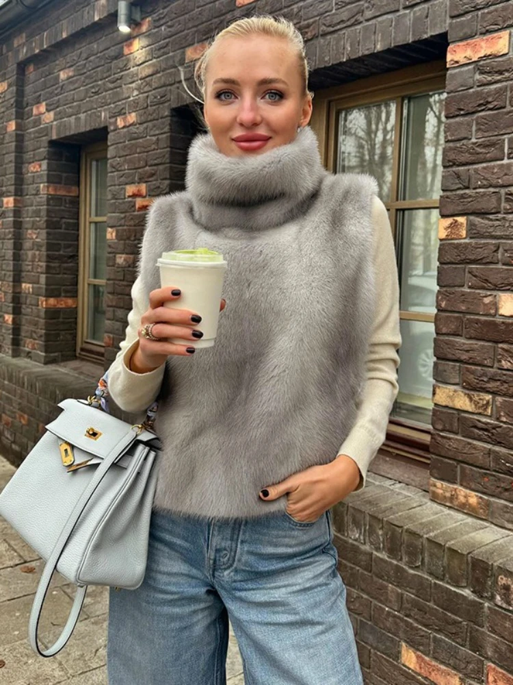 FDYOUI 2021, осенне-зимняя водолазка, жилеты из искусственного меха, женский модный жилет без рукавов на пуговицах, верхняя одежда без рукавов, уличная одежда
FDYOUI 2021, осенне-зимняя водолазка, жилеты из искусственного меха, женский модный жилет без рукавов на пуговицах, верхняя одежда без рукавов, уличная одежда