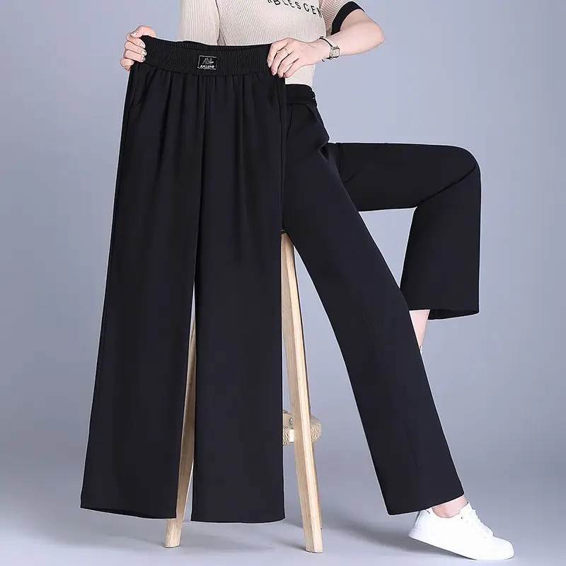 Летние прямые женские модные универсальные однотонные широкие брюки с эластичной резинкой на талии, женская одежда, свободные брюки
Летние прямые женские модные универсальные однотонные широкие брюки с эластичной резинкой на талии, женская одежда, свободные брюки