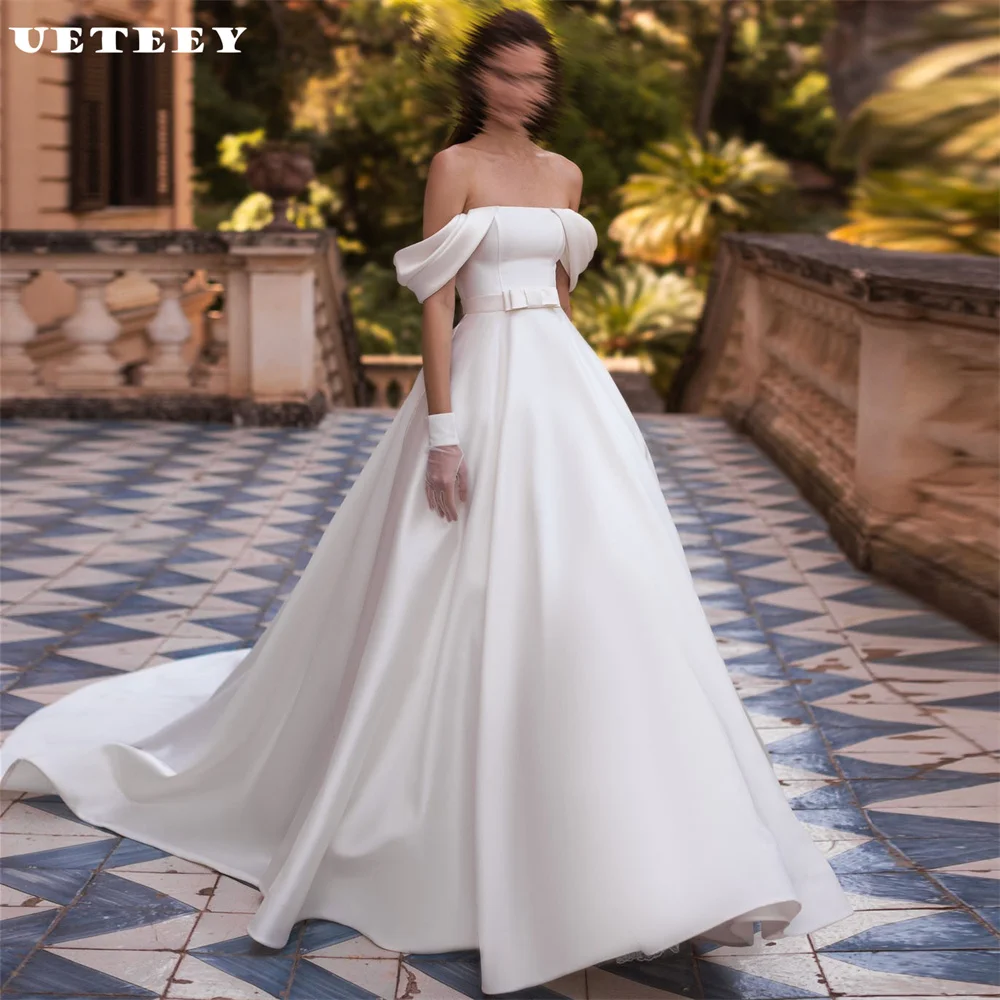 UETEEY Customized Princess Bow Off Shoulder Satin Wedding Dress Elegant A Line Zipper Back Floor Length Court Train Bridal Gown
UETEEY Customized Princess Bow Off Shoulder Satin Wedding Dress Elegant A Line Zipper Back Floor Length Court Train Bridal Gown