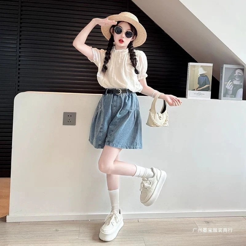 Girls' Summer Outfit Set2026New stylish doll shirt top for children, two-piece set with denim short skirt and pants for older ki
Girls' Summer Outfit Set2026New stylish doll shirt top for children, two-piece set with denim short skirt and pants for older ki