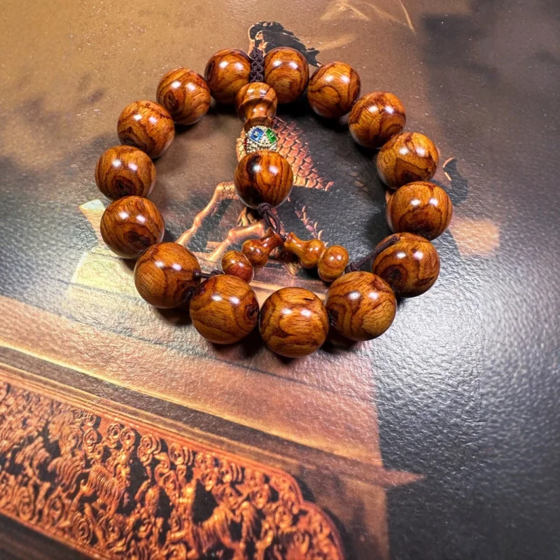 Authentic Hainan Huanghuali 15-bead Buddha with ghost face and eye motifs, unisex cultural toy bracelet, available at p
Authentic Hainan Huanghuali 15-bead Buddha with ghost face and eye motifs, unisex cultural toy bracelet, available at p