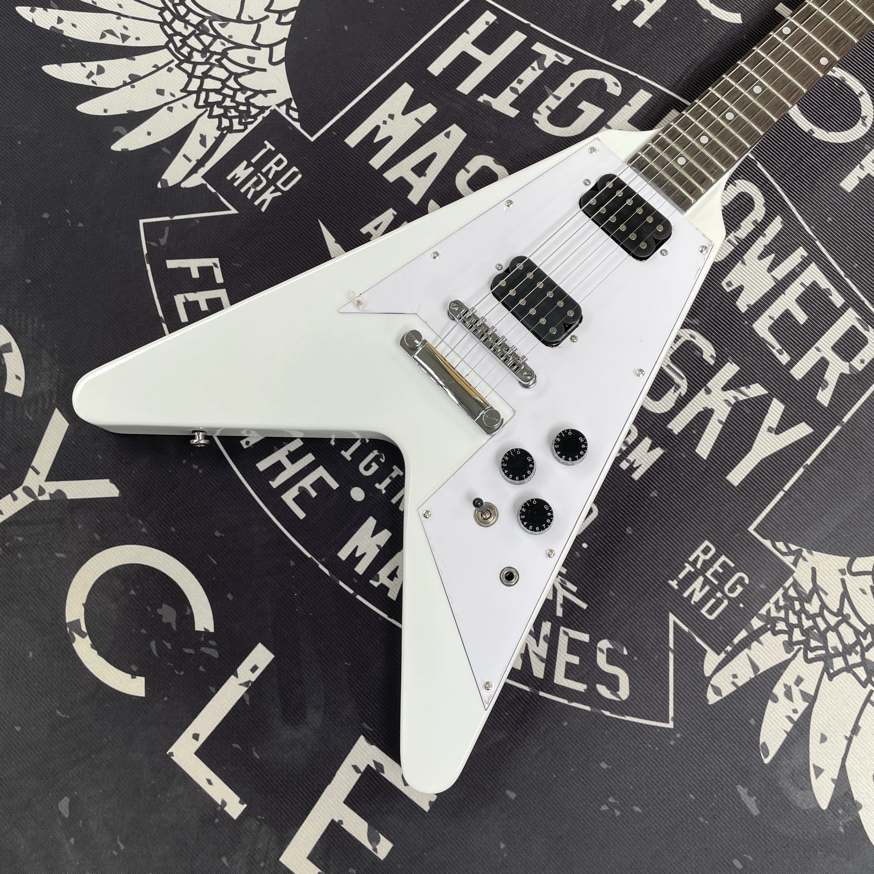 White V-Shaped Electric Guitar with High-Output Pickups and a Mahogany Body, Suitable for Metal and Rock Music
White V-Shaped Electric Guitar with High-Output Pickups and a Mahogany Body, Suitable for Metal and Rock Music