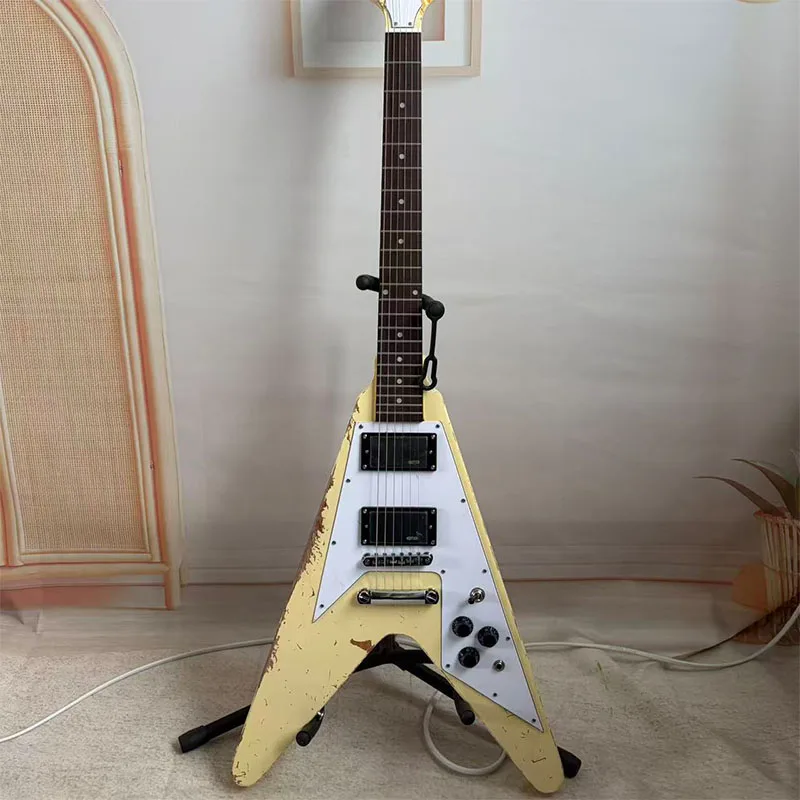 V-shaped distressed electric guitar, unique hand-painted, cream yellow finish, H-H solid wood body, free shipping
V-shaped distressed electric guitar, unique hand-painted, cream yellow finish, H-H solid wood body, free shipping