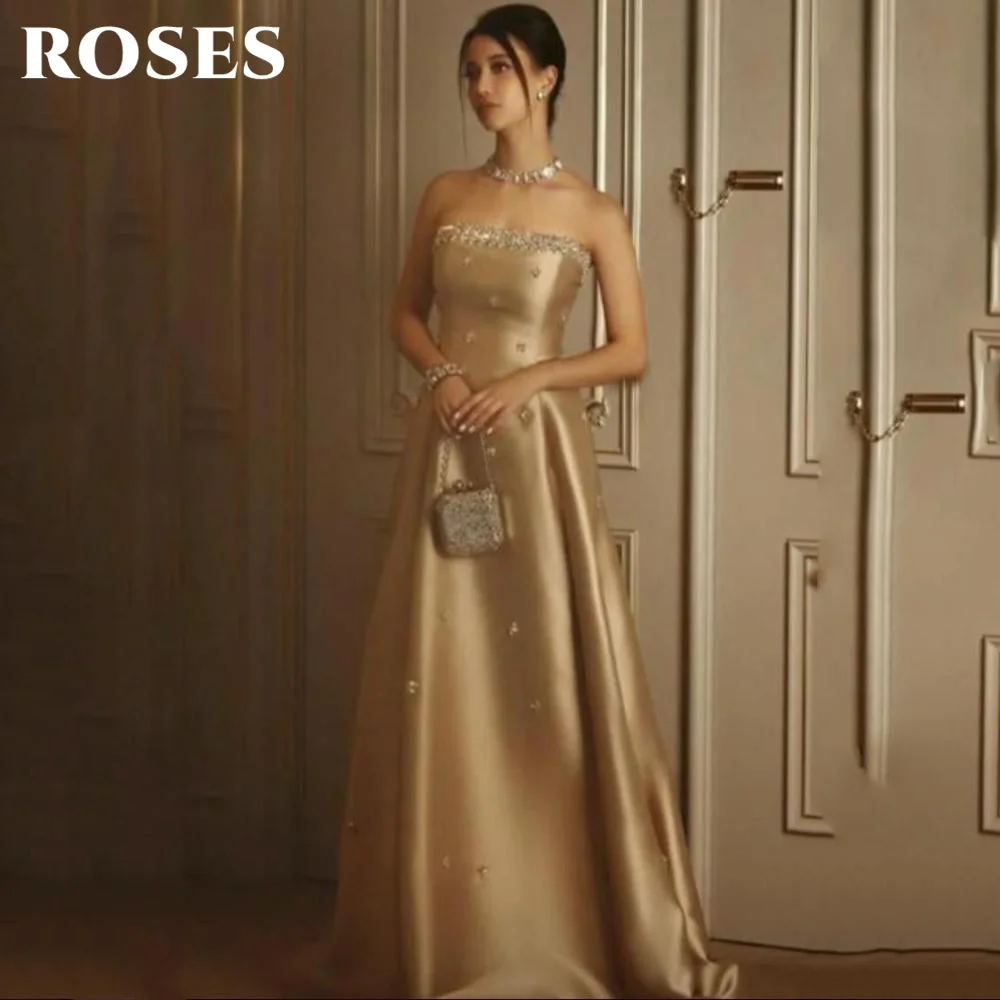 Роскошное золотое вечернее платье без бретелек ROSES فساتين السهرة с хрустальными украшениями Платья для выпускного вечера по индивидуальному заказу
Роскошное золотое вечернее платье без бретелек ROSES فساتين السهرة с хрустальными украшениями Платья для выпускного вечера по индивидуальному заказу