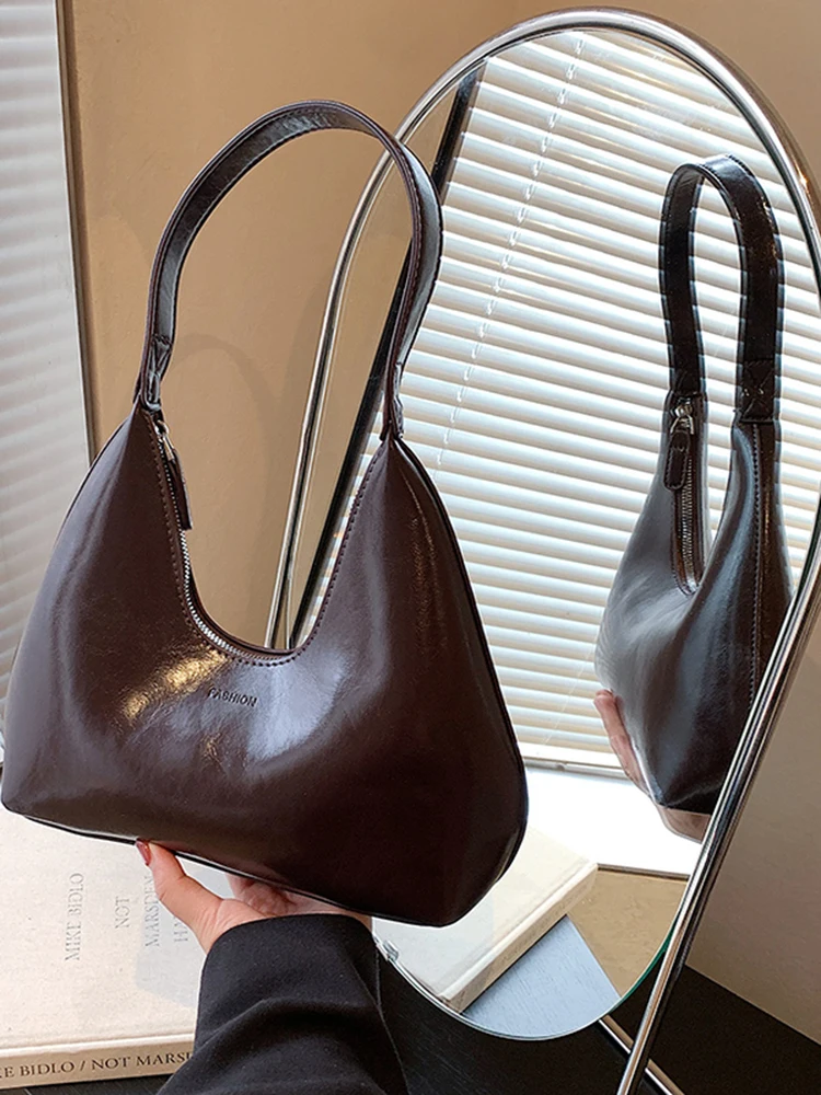 Высококачественная текстура, простые сумки на одно плечо из искусственной кожи, женская трендовая модная универсальная однотонная сумка, элегантная пригородная сумка подмышками
Высококачественная текстура, простые сумки на одно плечо из искусственной кожи, женская трендовая модная универсальная однотонная сумка, элегантная пригородная сумка подмышками