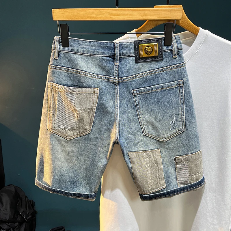 TC3019 Summer denim shorts broken holes male tide elastic Slim embroidery patches high-end Chinese trousers
TC3019 Summer denim shorts broken holes male tide elastic Slim embroidery patches high-end Chinese trousers